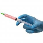 Doctor Holding Medical Injecti